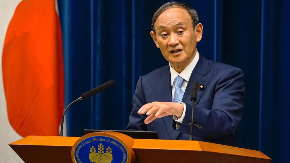 epa09417870 Japanese Prime Minister Yoshihide Suga during a news conference with the chairman of the government's pandemic advisory panel, at the prime minister's official residence in Tokyo, Japan, 17 August 2021. Suga announced during the news conference to extend the state of emergency in six prefectures including Tokyo and expand to other seven prefectures until 12 September 2021, as the numbers of "serious (Covid-19) cases are increasing rapidly."  EPA/KIMIMASA MAYAMA / POOL