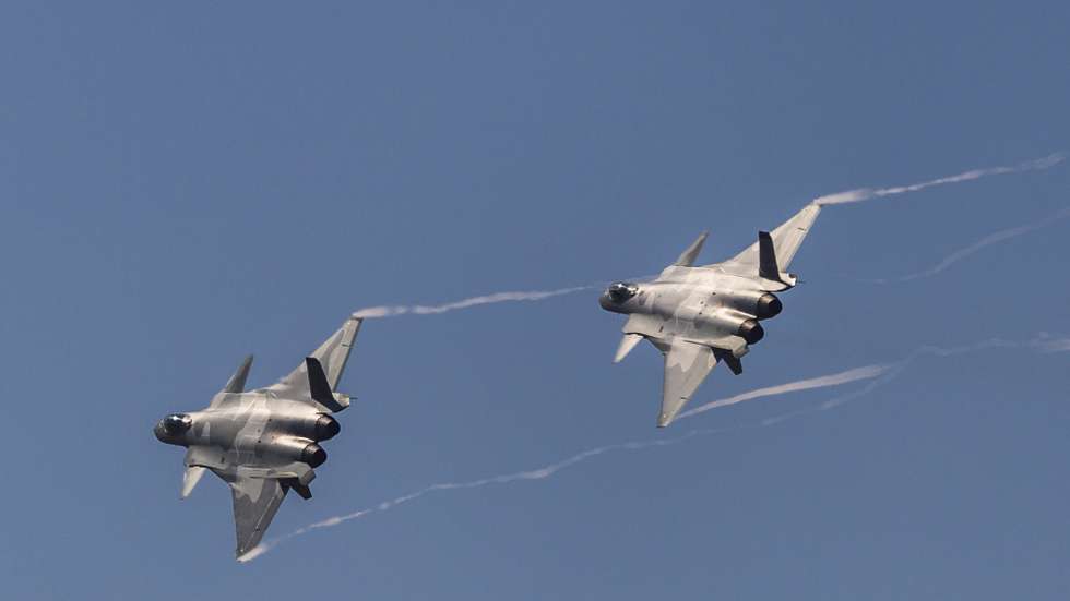 epa07144126 Two Chinese J-20 'Chengdu' stealth fighter jets perform during a flying display on the first day of a military airshow in Zhuhai, Guangzhou province, China, 06 November 2018. The China International Aviation and Aerospace Exhibition, China's largest international aerospace trade show, runs until 11 November 2018.  EPA/ALEKSANDAR PLAVEVSKI