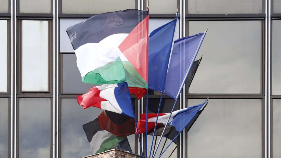 epa12397574 The Malakoff mayor's house flies the Palestinian flag (2-L) on its facade next to the French (L) and European Union (C) flags, in Malakoff near Paris, France, 22 September 2025. Several French mayors are defying government neutrality orders to display Palestinian flags on town halls and other public buildings ahead of a formal state recognition. After Canada, the United Kingdom, Australia, and Portugal, France will officially recognize the State of Palestine on 22 September 2025, with a speech by French President Macron at the United Nations (UN) General Assembly.  EPA/MOHAMMED BADRA