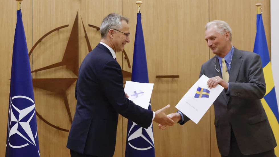 epa09954346 NATO Secretary-General Jens Stoltenberg (L) and Sweden's Ambassador to NATO Axel Wernhoff shake hands during a ceremony to mark Sweden's and Finland's application for membership in Brussels, Belgium, 18 May 2022. Finland and Sweden are applying for NATO membership as a result of Russia's invasion of Ukraine. The move would bring the expansion of the Western military alliance to 32 member countries.  EPA/JOHANNA GERON / POOL
