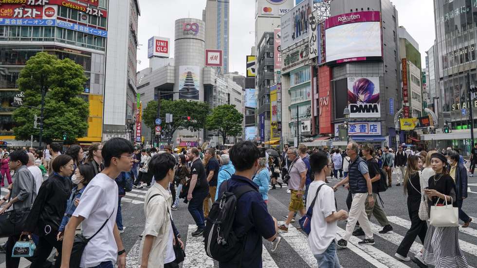 epa11344006 Pedestrians walk a scramble crossway at Shibuya in Tokyo, Japan, 16 May 2024. Japan's Cabinet Office announced on 16 May 2024 the gross domestic product (GDP) for the January-March in 2024 decreased 0.5 percent from the previous quarter, an annualized decline of 2.0 percent.  EPA/KIMIMASA MAYAMA