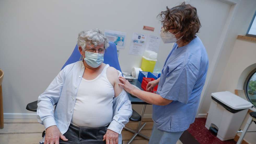 epa08981200 A man is vaccinated against COVID-19 at Brussels' first vaccination center, in Brussels, Belgium, 02 February 2020. This center can perform up to 900 vaccinations per day. The first to be vaccinated are the non-hospital nursing staff.  EPA/STEPHANIE LECOCQ