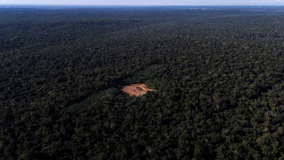 epa11423308 Aerial view shows a deforested area with a red-painted metal structure used to maintain pressure and control gas flow in the Amazon rainforest, Brazil, 14 June 2024 (issued 19 June 2024). The extraction of natural gas in the middle of the Brazilian Amazon has put the Mura people on the warpath. While the authorities speak of development for the region, this ethnic group fears for the rivers and forests on which it lives and has initiated a legal struggle to stop the project.  EPA/Antonio Lacerda