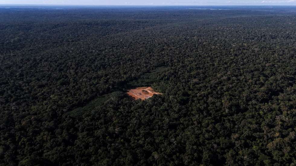 epa12200416 (FILE) - Aerial view shows a deforested area with a red-painted metal structure used to maintain pressure and control gas flow in the Amazon rainforest, Brazil, 14 June 2024 (reissued 27 June 2025). The UN International Day of the Tropics, on 29 June, is observed to raise awareness of the diversity and extraordinary challenges faced by the world’s tropical regions  EPA/ANTONIO LACERDA