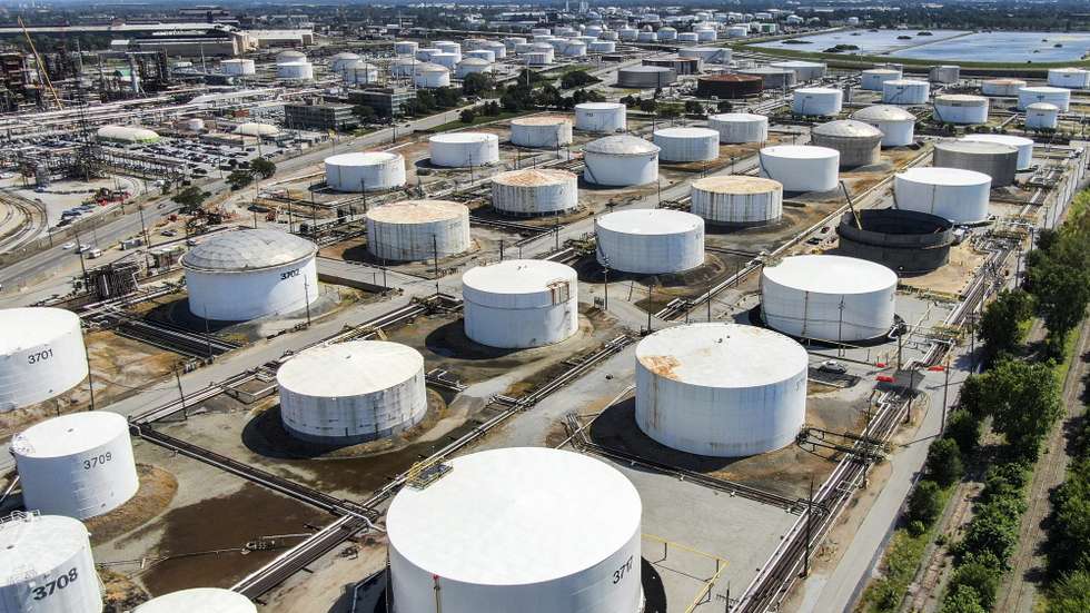 epa07803127 An aerial view taken with a drone shows oil storage tanks at the BP oil refinery in Whiting, Indiana, USA, 29 August 2019. The facility has the capability of handling 400,000 barrels of crude oil per day and it is the sixth largest oil refinery in the USA. Standard Oil of Indiana first established the refinery in 1889.  EPA/TANNEN MAURY