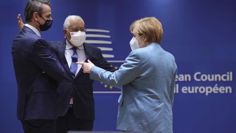 epa08874507 German Chancellor Angela Merkel (R) speaks with Greek Prime Minister Kyriakos Mitsotakis (L) and Portugal&#039;s Prime Minister Antonio Costa at the start of a two days face-to-face EU summit , in Brussels, Belgium, 10 December 2020.  EU Leader will mainly focus on response to the COVID-19, Multi annual framework (MFF) agreement , new EU emissions reduction target for 2030.  EPA/OLIVIER MATTHYS / POOL