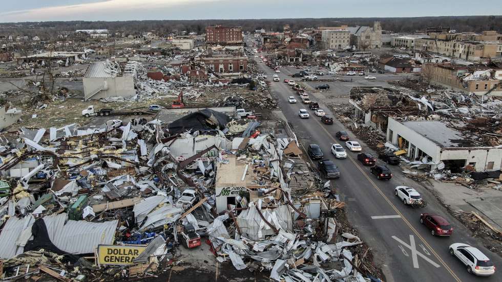 epa09637516 An aerial photo made with a drone shows widespread destruction of homes and businesses after tornadoes moved through the area leaving destruction and death across six states, in Mayfield, Kentucky, USA, 11 December 2021. According to early reports as many as 75 to 100 people lost their lives in Kentucky with more dead in Arkansas in the storms on 10 December.  EPA/TANNEN MAURY