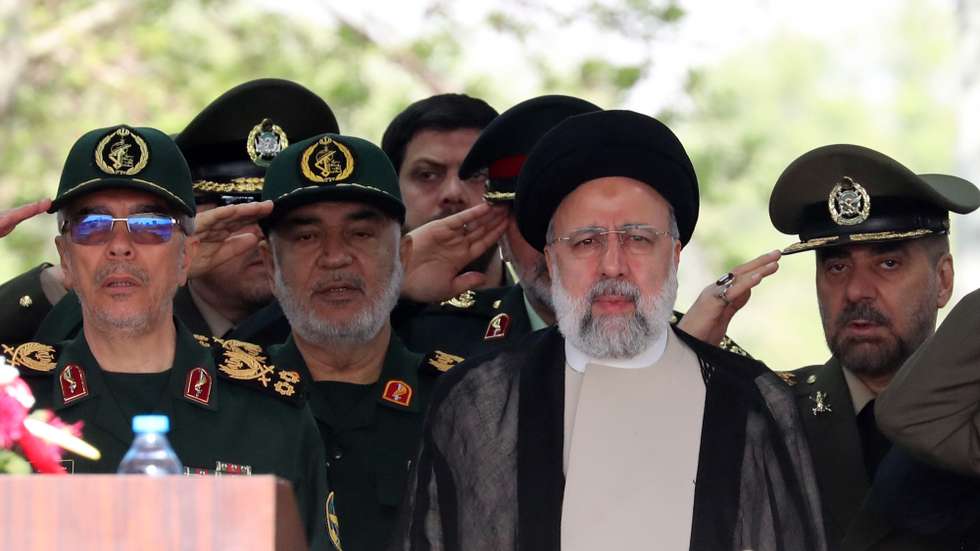epaselect epa11283751 Iranian President Ebrahim Raisi (3-L) flanked by Iranian IRGC and Army generals arrives during the annual Army Day at a military base in Tehran, Iran, 17 April 2024. According to Iranian state media, Raisi described the recent attack launched towards Israel as 'limited' and 'punitive', adding that any act of aggression against Iran will be dealt with a 'powerful and fierce' response. Iran's Islamic Revolutionary Guards Corps (IRGC) launched drones and rockets towards Israel late on 13 April.  EPA/ABEDIN TAHERKENAREH