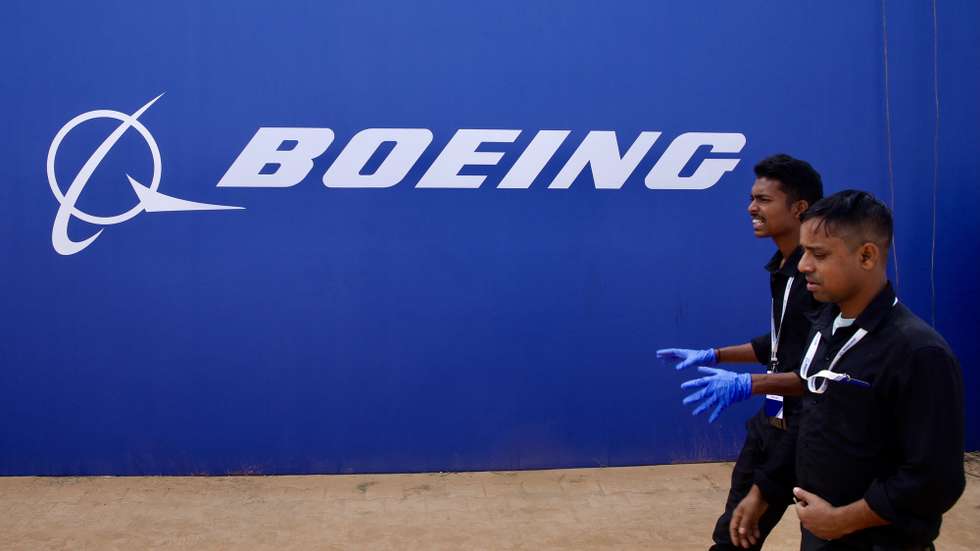 epa11090126 Boeing employees walks infront of the Logo during the inaugural event of Boeing’s aerospace engineering facility and technology centre campus and 'Boeing Sukanya Programme' that 'aims to support the entry of more girl children from across India into the country's growing aviation sector' in Bangalore, India, 19 January 2024. The Boeing India Engineering &amp; Technology Center (BIETC) campus is the largest aerospace engineering facility outside the United States with 43-acre and the centre has been built for Rs 1,600 crore (192,530,24 USD), where Boeing India has grown over 6,000 engineering and Research and Development talent employees in any country outside the United States.  EPA/JAGADEESH NV