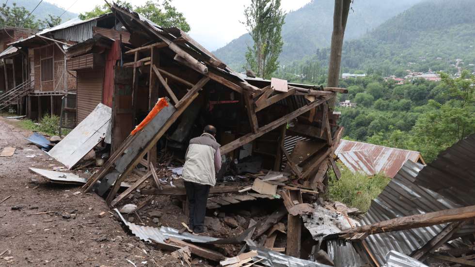 epa12085367 An Indian Kashmiri man inspects a house damaged by cross-border shelling from Pakistan, near the line of control at Lagamma Uri, Kashmir, India, 09 May 2025. According to Wing Commander Vyomika Singh, on the night of 07 and 08 May 2025, Pakistan attempted to engage a number of military targets in northern and western India using drones and missiles and Indian armed forces targeted air defence radars and systems at a number of locations in Pakistan.  EPA/FAROOQ KHAN