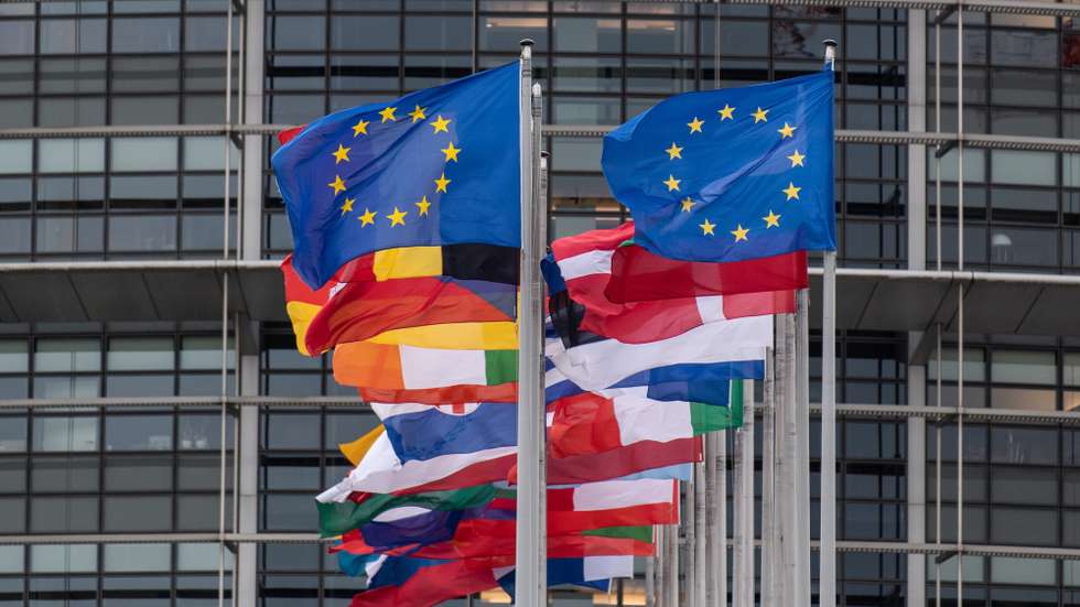 epa08210653 European countries' flags and the European Union flag fly in front of the 'Louise Weiss Building', the seat of the European Parliament, in Strasbourg, France, 11 February 2020.  EPA/PATRICK SEEGER