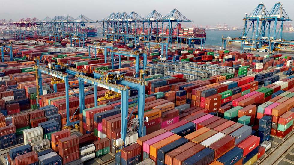 epa08867889 A view of a busy container port in Qingdao, Shandong province, China, 01 December 2020 (issued 07 December 2020). China's exports in November jumped by 21.1 percent by US dollar value from a year earlier, with exports to the United States rose 46 percent to make a record 75.4 billion US dollar trade surplus with the US.  EPA/ZHANG JINGANG CHINA OUT