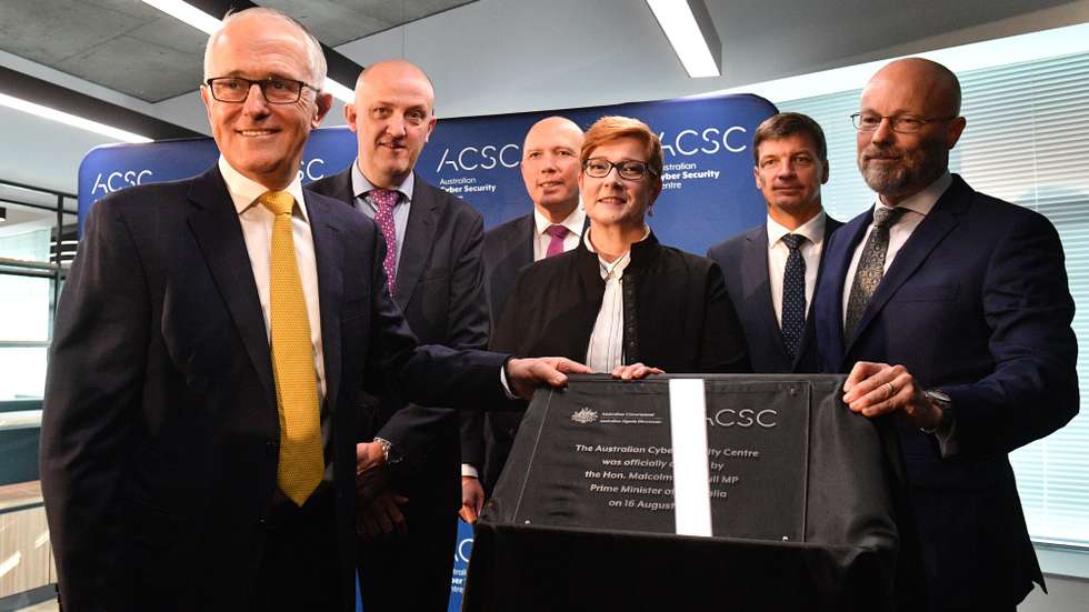 epa06952039 Prime Minister Malcolm Turnbull (L), Australian Signals Directorate Director-General Mike Burgess (2-L), Minister for Home Affairs Peter Dutton (3-L), Minister for Defence Marise Payne (3-R), Minister for Cyber Security Angus Taylor (2-R)Â and National Cyber Coordinator Alastair MacGibbon (R) pose for photos during the opening of the Australian Cyber Security Centre at the Brindabella Business Park in Canberra, Australia, 16 August 2018. The new center will be used to combat cyber security threats and to provide information and advice to Australians.  EPA/MICK TSIKAS  AUSTRALIA AND NEW ZEALAND OUT