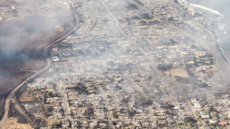 epa10792531 A handout photo made available by Carter Barto shows an arial view of buildings damaged in Lahaina, Hawaii as a result of a large wildfire which has killed 6 people and forced thousands of evacuations on the island of Maui in Hawaii, USA, 09 August 2023. Winds from Hurricane Dora, which is currently over the Pacific Ocean hundreds of miles south of Hawaii, have intensified the wildfires.  EPA/CARTER BARTO / HANDOUT  HANDOUT EDITORIAL USE ONLY/NO SALES