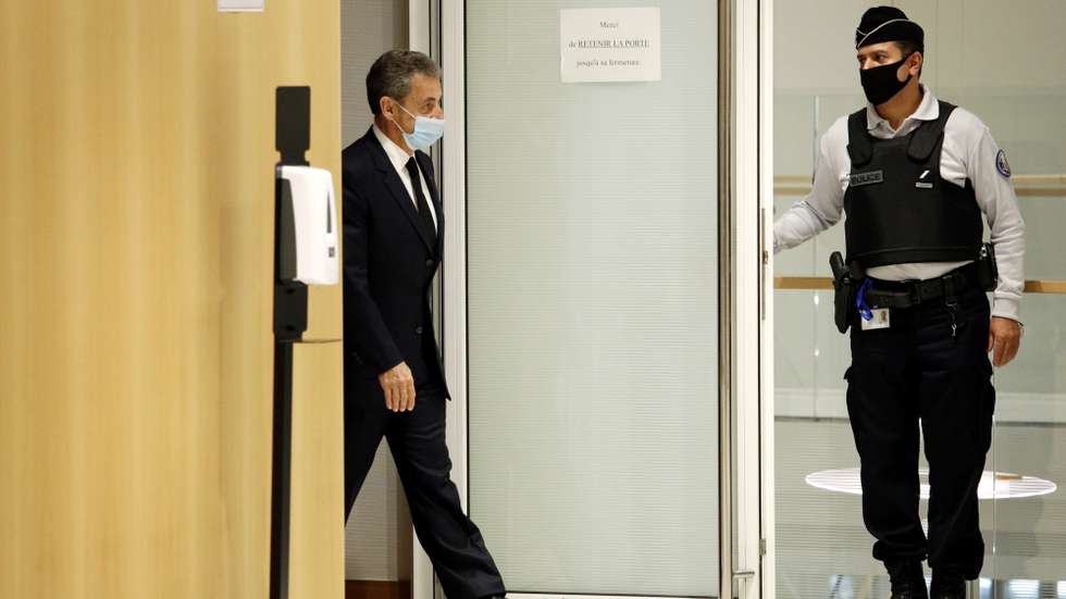 epaselect epa08843473 Former French president Nicolas Sarkozy (C) leaves the courtroom during his trial on corruption charges in the so-called 'wiretapping affair' in Paris, France, 26 November 2020. In 2013, Nicolas Sarkozy was using a false name, Paul Bismuth, to make phone calls to call his lawyer, Thierry Herzog, about the decision that the Court of Cassation was about to take regarding the seizure of presidential diaries in a separate case. The trial is due to run from 23 November to 10 December.  EPA/YOAN VALAT *** Local Caption *** 55512057