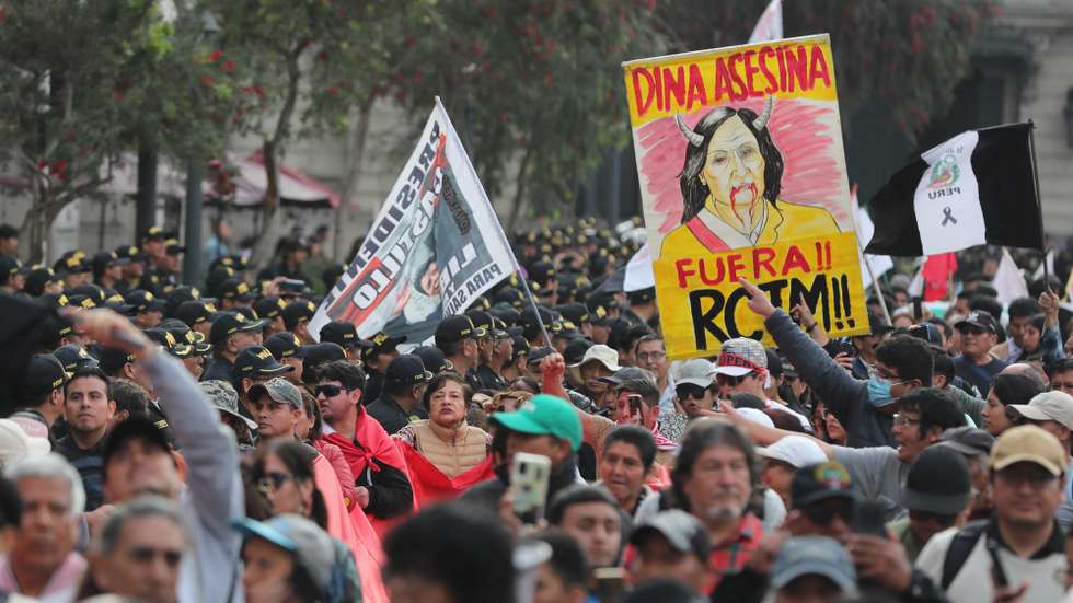 epa12394249 People hold signs during a protest at Plaza San Martín, in Lima, Peru, 20 September 2025. The demonstration was organized by Generation Z in opposition to the government, the Pension Fund Administration (AFP) law, corruption, and urban violence.  EPA/Paolo Aguilar