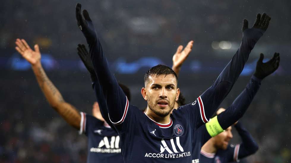 epa09760481 Leandro Paredes (front) of PSG and teammates celebrate after winning the UEFA Champions League round of 16, first leg soccer match between Paris Saint-Germain (PSG) and Real Madrid in Paris, France, 15 February 2022.  EPA/Yoan Valat