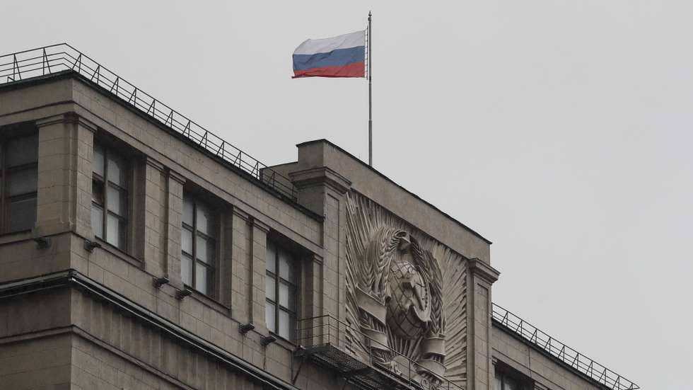 epa10221108 The Russian national flag over the State Duma building in Moscow, Russia, 03 October 2022. The State Duma, the lower house of the Federal Assembly of Russia, ratified agreements on the admission of four new subjects to the Russian Federation: the Donetsk and Luhansk People's Republics, Kherson and Zaporizhzhia regions of Ukraine. From 23 to 27 September, residents of the self-proclaimed Luhansk and Donetsk People's Republics as well as the Russian-controlled areas of the Kherson and Zaporizhzhia regions of Ukraine voted in a so-called 'referendum' to join the Russian Federation. Putin held a signing ceremony to annex the four areas last week.  EPA/YURI KOCHETKOV