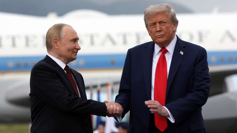 epa12303633 US President Donald Trump (R) and Russian President Vladimir Putin pose on the podium on the tarmac after they arrived to attend a meeting at Joint Base Elmendorf-Richardson in Anchorage, Alaska, USA, 15 August 2025.  EPA/GAVRIIL GRIGOROV/SPUTNIK/KREMLIN POOL / POOL MANDATORY CREDIT