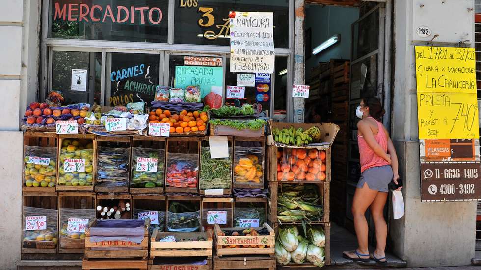 epa09683285 A person buys at a store, in Buenos Aires, Argentina, 13 January 2022. Argentina disseminates the data on accumulated inflation in 2021, which will clearly be high again after it showed a year-on-year variation of 51.2 percent in November in a delicate context in which analysts already assure that the rise in prices will continue being persistent in 2022.  EPA/Enrique Garcia Medina