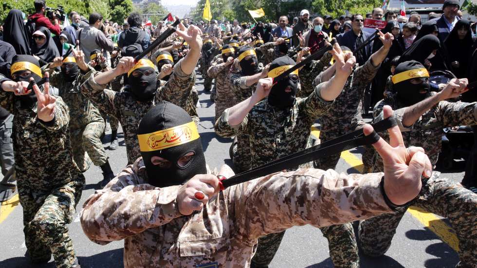 epa10572185 Members of the Basij paramilitary forces take part in a rally marking Al Quds Day in Tehran, Iran, 14 April 2023. Al-Quds Day was declared in 1979 by the late Ayatollah Khomeini, founder of the Islamic Iranian Republic, who called on the world's Muslims to show solidarity with Palestinians on the last Friday of the fasting month of Ramadan.  EPA/ABEDIN TAHERKENAREH
