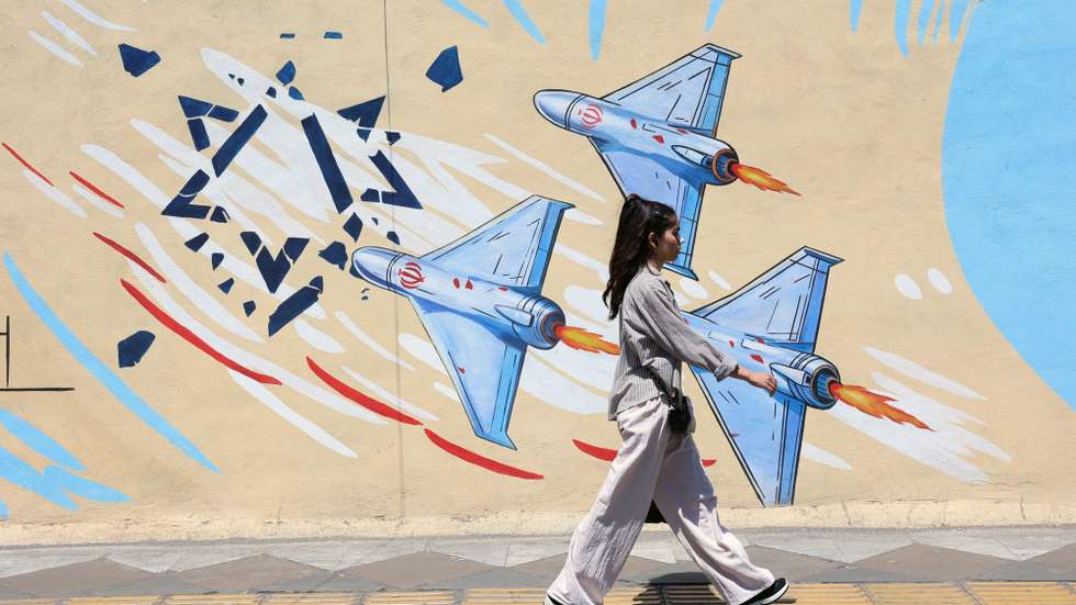 epaselect epa13023951 An Iranian girl walks past an anti-Israeli mural on a street in Tehran, Iran, 08 June 2026. Iran and Israel exchanged fire after Iran launched missiles at Israel in retaliation for an earlier Israeli strike on Beirut's southern suburbs. Iran and Israel have targeted each other since a fragile US-brokered ceasefire went into effect in early April.  EPA/ABEDIN TAHERKENAREH RESTRICTIONS: NO Access Israel Media/Persian Language TV Stations Outside Iran/Strictly No Access BBC Persian/VOA Persian/Manoto TV/Iran International TV. (As mandated by Iran's Directorate General for Foreign Media) --