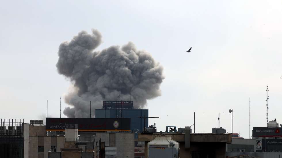 epaselect epa12789292 Smoke rises in central Tehran after an airstrike in Tehran, Iran, 02 March 2026. A joint Israeli and US military operation continues to target multiple locations across Iran since the early hours of 28 February 2026.  EPA/ABEDIN TAHERKENAREH