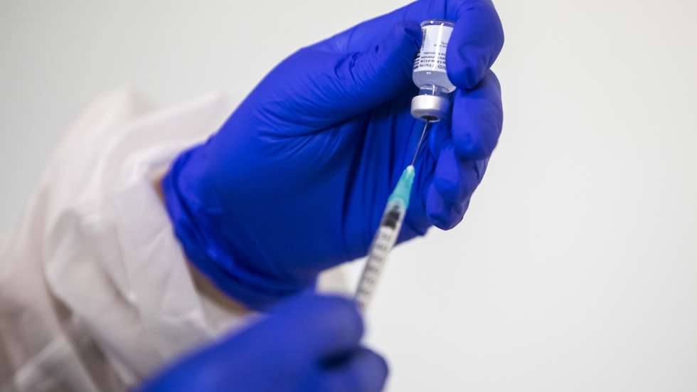 A health worker holds a vial of the Pfizer/BioNtech COVID-19 vaccine during first vaccination Santa Marial Hospital in Lisbon, Portugal, 28 December 2020. Medical personnel is the first group to get the jabs, followed by senior citizens. JOSE SENA GOULAO/LUSA