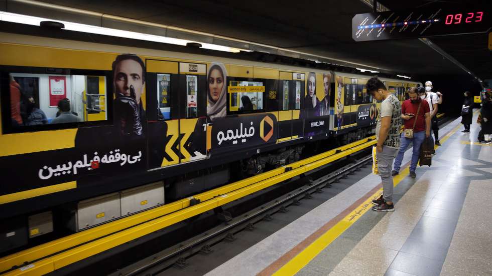 epa08477017 Iranians wait for a train in a subway station in Tehran, Iran, 10 June 2020. Media reported that according to the last report by the health ministry the spread of novel coronavirus (Covid-19) is growing up while in past 24 hours 2011 new cases have been diagnosed and 84 people died. Iranian health ministry warned people to don’t use subways as much as they can.  EPA/ABEDIN TAHERKENAREH