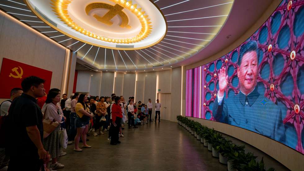 epa13077477 People watch a film with Chinese President Xi Jinping during their visit to the Memorial Hall of the First National Congress of the Communist Party of China (CCP) amid the celebrations of the CCP 105 anniversary, in Shanghai, China, 01 July 2026. China celebrates the 105th anniversary of the founding of the ruling Chinese Communist Party on 01 July.  EPA/ALEX PLAVEVSKI
