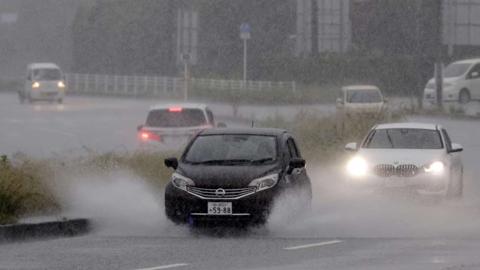 epa13068467 Vehicles drive through heavy rain caused by typhoon Mekkhala in Tateyama, Chiba prefecture, near Tokyo, Japan, 27 June 2026. The Japan Meteorological Agency (JMA) has placed large swathes of the country under high alert for flooding, swollen rivers, and landslides, as the country deals with a rare double-tropical storm threat from Mekkhala (Typhoon No. 7) and Higos (Typhoon No. 8). Mekkhala is moving rapidly northeastward along the Pacific coast toward the Kanto Plain, and it is expected to become an extratropical cyclone by early 28 June.  EPA/FRANCK ROBICHON