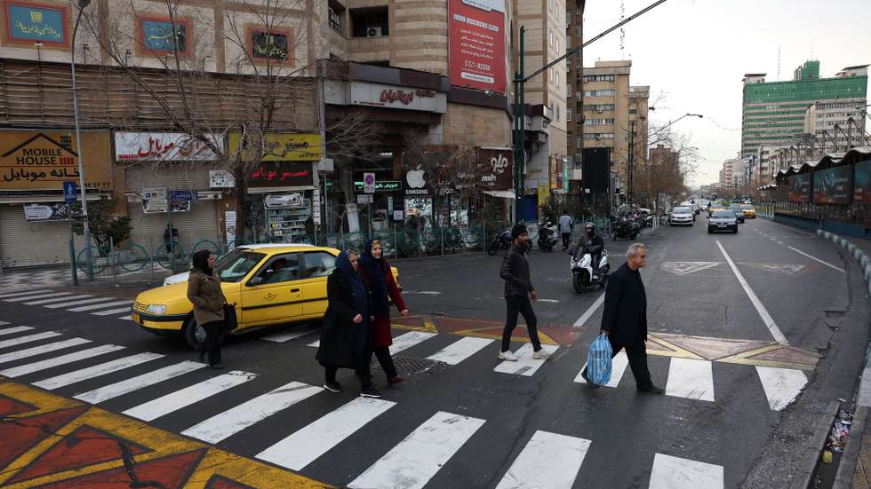 epa12661228 Iranians walk in street in Tehran, Iran, 19 January 2026. Iran is experiencing a nationwide internet blackout that began on 08 January 2026, amid an intensifying wave of anti-government protests.  EPA/ABEDIN TAHERKENAREH