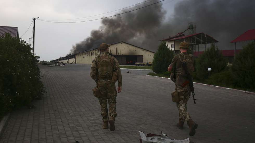 epa09988725 Ukrainian servicemen patrol the territory close to a front line near the small city of Bakhmut, Donetsk region, Ukraine, 31 May 2022. Russian troops entered Ukraine on 24 February resulting in fighting and destruction in the country and triggering a series of severe economic sanctions on Russia by Western countries.  EPA/STR