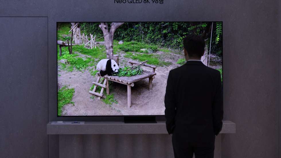 epa11217744 A visitor looks at the new Samsung AI Neo QLED 8K TV during the 'Unbox &amp; Discover 2024' launch event at the company's headquarters in Seoul, South Korea, 13 March 2024. At the launch, Samsung Electronics announced the new range of Neo QLED AI TVs that will be available for consumers to purchase.  EPA/JEON HEON-KYUN