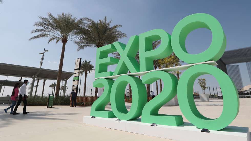 epa08986653 People walk at the building of Terra the Sustainability Pavilion at Expo 2020 Dubai site, Dubai, United Arab Emirates, 27 January 2021 (issued 04 February 2021). Terra, the Sustainability Pavilion, has been opened to the public, ahead of the Expo 2020 official opening scheduled for 01 October after it was postponed from October 2020 due to the COVID 19 pandemic.  EPA/ALI HAIDER