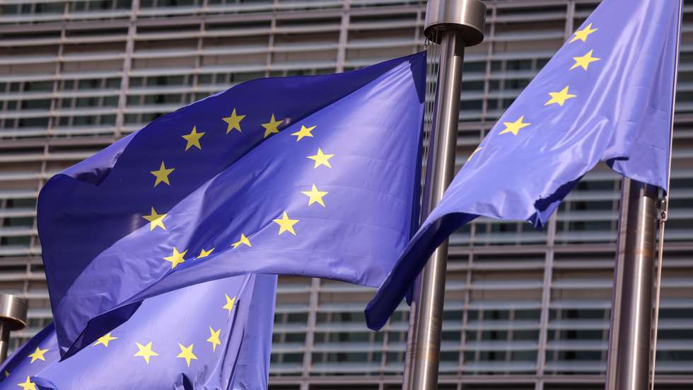epa13143984 EU flags wave in front of the European Commission headquarters in Brussels, Belgium, 31 July 2026. The Commission is planning a briefing on the situation in the Spanish enclave of Ceuta amid a sharp increase in migrant arrivals. Thousands of migrants attempted to cross into Ceuta from Morocco in recent days.  EPA/OLIVIER HOSLET