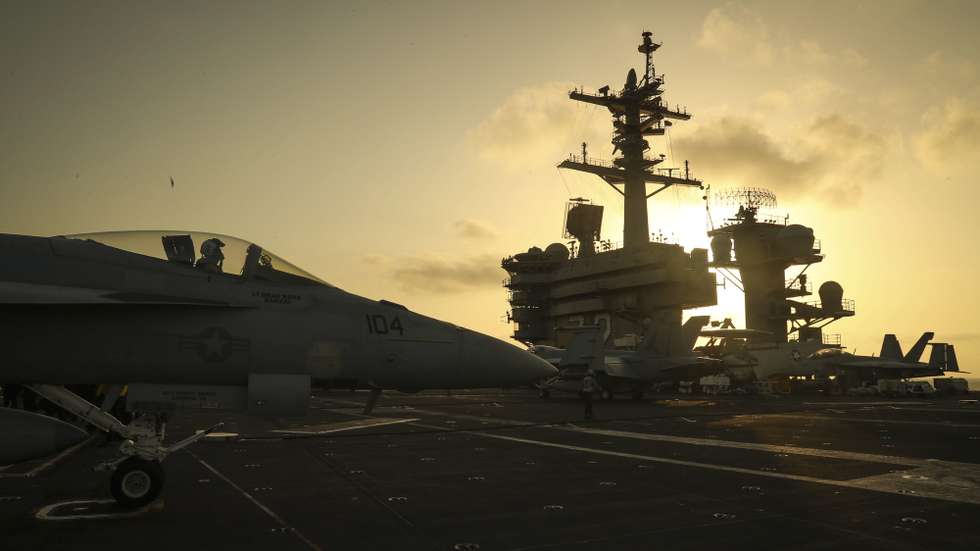 epa07632522 A handout photo made available by the US Navy shows the sun setting behind the Nimitz-class aircraft carrier USS Abraham Lincoln (CVN 72), in the Arabian Sea, 03 June 2019 (reissued 07 June 2019). The Abraham Lincoln Carrier Strike Group (CSG) 12 is deployed in the region amid heightened tensions between the US and Iran, with both saying they don't seek war.  EPA/US NAVY/MC 3RD CLASS JEFF SHERMAN HANDOUT  HANDOUT EDITORIAL USE ONLY/NO SALES