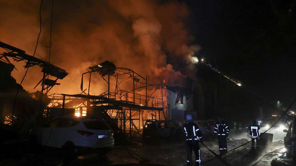 epa10955624 Emergency personnel work at the site of a drone strike in Kharkiv, northeastern Ukraine, early 03 November 2023, amid the Russian invasion. The Kharkiv region police said at least 10 Russian drones hit Kharkiv and its suburbs, and as a result of the strikes, a residential building, a service station, and an administrative building were on fire. There were no immediate reports on casualties, police added. Russian forces launched a 'massive attack' on Ukraine overnight, with strikes reported in the regions of Kharkiv, Kherson, Donetsk, Odesa and Ivano-Frankivsk, Ukrainian Interior Minister Ihor Klymenko wrote on telegram.  EPA/SERGEY KOZLOV
