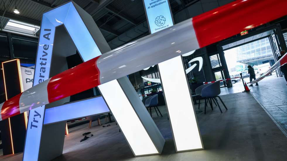 epa11999350 The lettering AI for 'Artificial Intelligence' stands at the Amazon Web Services AWS stand during preparations at the Hanover Fair (Hannover Messe) in Hanover, Germany, 30 March 2025. More than 4,000 exhibitors are expected to showcase their innovations from 31 March to 04 April at what is billed as the world's largest industrial trade fair, with visitors from approximately 150 countries expected. The main focus this year is on robotics, mechanical engineering, power-train technology, and energy production under the motto 'Energizing a Sustainable Industry.' The partner country in 2025 is Canada.  EPA/HANNIBAL HANSCHKE