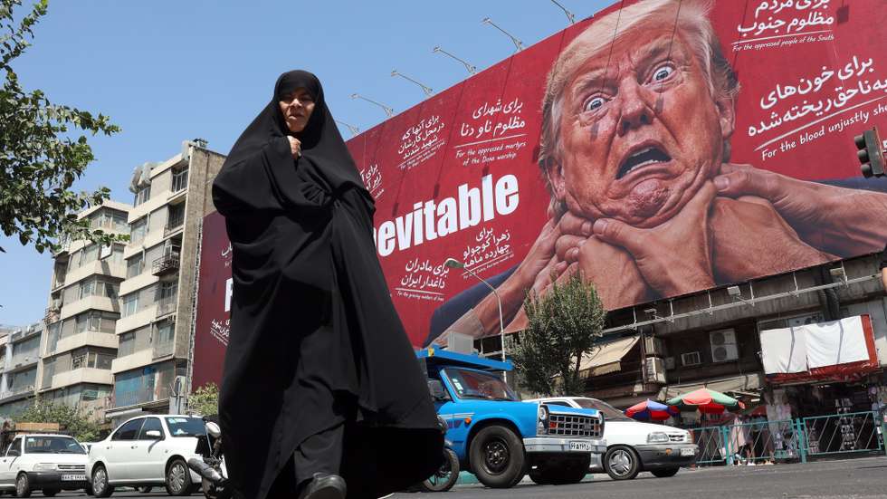 epaselect epa13178254 A woman walks next to an anti-Trump billboard in Tehran, Iran, 19 August 2026. Iranian parliament speaker Mohammad Bagher Ghalibaf said that the Strait of Hormuz will remain closed until the United States lifts its blockade and ends sanctions.  EPA/ABEDIN TAHERKENAREH RESTRICTIONS: NO Access Israel Media/Persian Language TV Stations Outside Iran/Strictly No Access BBC Persian/VOA Persian/Manoto TV/Iran International TV. (As mandated by Iran's Directorate General for Foreign Media) --