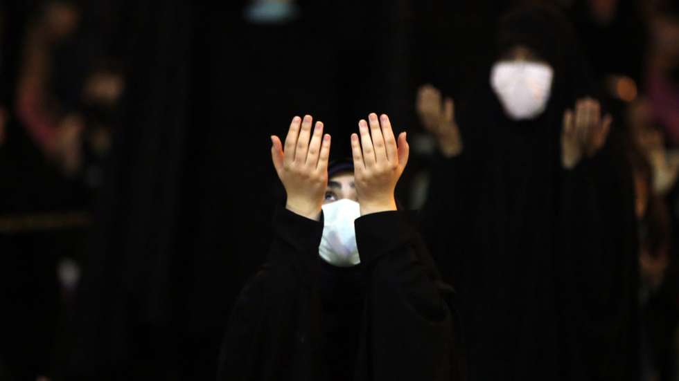 epa09176408 An Iranian girl prays during a religious ceremony called Laylat al-Qadr during the holy fasting month of Ramadan, outside  the Sadegh mosque in Tehran, Iran, 03 May 2021. Laylat al-Qadr (Arabic for Night of Destiny) is believed to be the night when the first verse of Islam's holy book, the Koran, was revealed to Prophet Muhammad, the exact date is not known but it is believed to be on an odd night of the last 10 nights of the holy month of Ramadan.  EPA/ABEDIN TAHERKENAREH