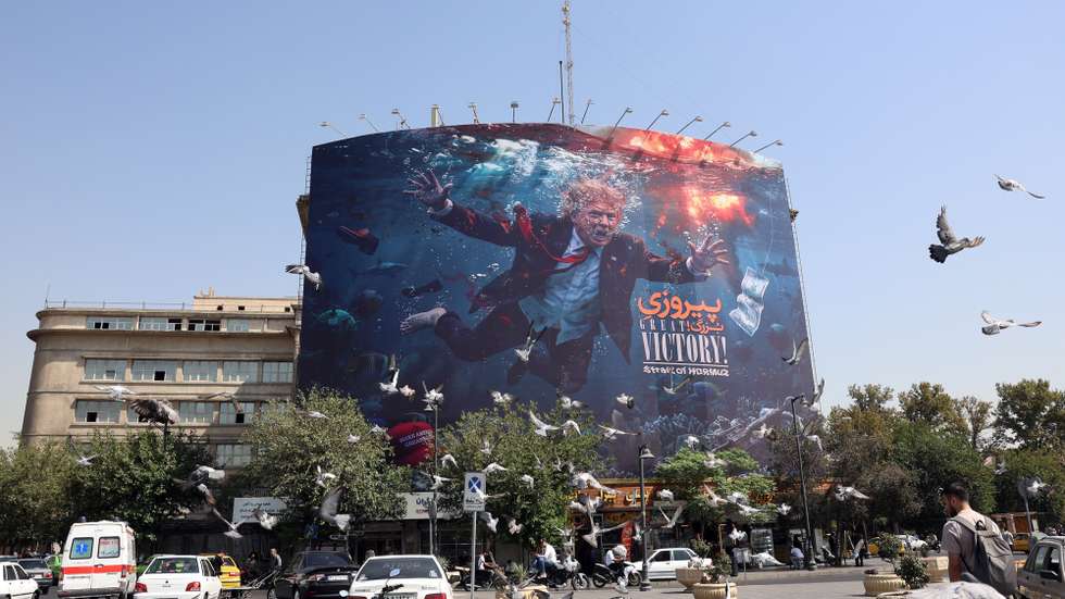 epa13188120 Birds perch near an anti-US billboard featuring US President Donald Trump in southern Tehran, Iran, 24 August 2026. US President Donald Trump said the US will launch 'economic D-Day' sanctions against Iran as the conflict between Iran and the US continues.  EPA/ABEDIN TAHERKENAREH RESTRICTIONS: NO Access Israel Media/Persian Language TV Stations Outside Iran/Strictly No Access BBC Persian/VOA Persian/Manoto TV/Iran International TV. (As mandated by Iran's Directorate General for Foreign Media) --