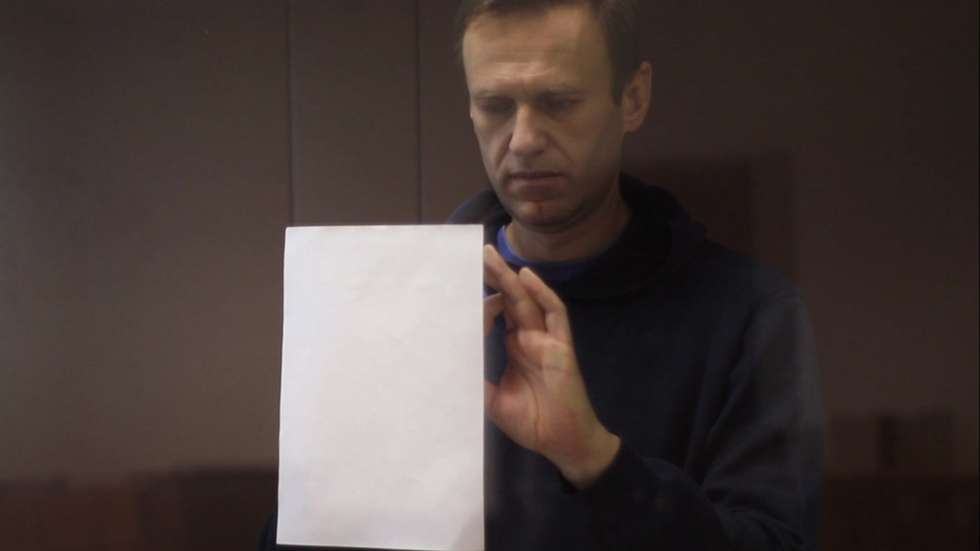 epa09015510 A still image taken from a handout video footage made available by the press service of the Babushkinsky district court shows Russian opposition leader Alexei Navalny inside a glass cage prior to a hearing of a case on slander charges in Moscow, Russia, 16 February 2021. In June 2020 the Russian Investigative Committee opened a criminal case against Alexei Navalny on charges of slander against WWII veteran Ignat Artemenko after NavalnyÃ•s comment about a video promoting the amendments to the Russian Constitution.  EPA/BABUSHKINSKY DISTRICT COURT PRES -- MANDATORY CREDIT -- BEST QUALITY AVAILABLE -- HANDOUT EDITORIAL USE ONLY/NO SALES
