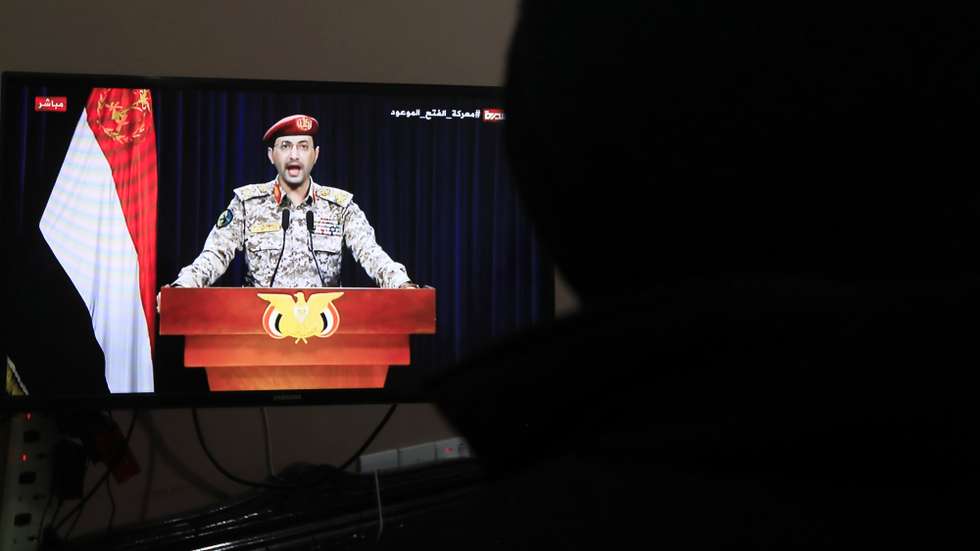 epa11116705 A person watches Houthi military spokesman Yahya Sarea delivering a TV statement over a fresh missile attack on a US ship, in Sana'a, Yemen, 31 January 2024. Yemen's Houthis have claimed responsibility for a new missile attack on a US commercial ship, just hours after they launched several naval missiles at a US destroyer in the southern Red Sea in defense of the Palestinian people and in response to US-led retaliatory strikes on Houthi positions, according to Sarea. The US Department of State on 17 January 2024 announced the designation of Yemen's Houthis as a 'Specially Designated Global Terrorist group' amid an escalation of their attacks on shipping lanes in the Red Sea, the Bab al-Mandab Strait, and the Gulf of Aden since November 2023. The US Department of Defense announced in December 2023 a multinational operation to safeguard trade and protect ships in the Red Sea amid the escalation in Houthi attacks.  EPA/YAHYA ARHAB