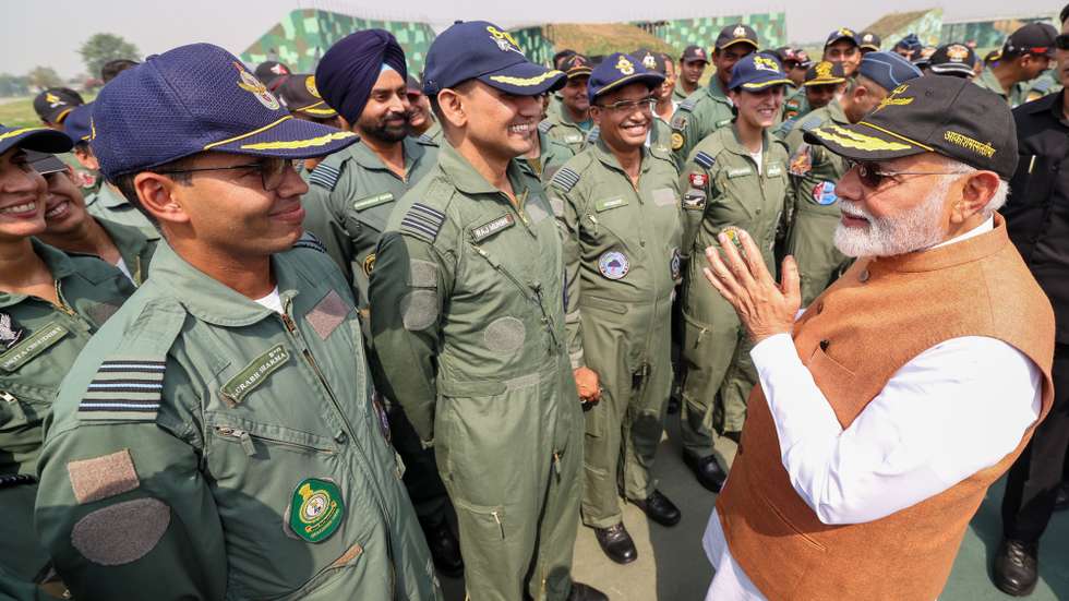 epa12096468 A handout photo made available by Indian Press Information Bureau (PIB) shows Indian Prime Minister Narendra Modi (R) meeting Indian soldiers at Adampur Air Force base, Punjab, India, 13 May 2025.  EPA/INDIAN PRESS INFORMATON BUREAU HANDOUT HANDOUT EDITORIAL USE ONLY/NO SALES