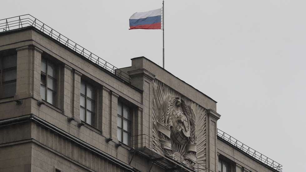 epa10221108 The Russian national flag over the State Duma building in Moscow, Russia, 03 October 2022. The State Duma, the lower house of the Federal Assembly of Russia, ratified agreements on the admission of four new subjects to the Russian Federation: the Donetsk and Luhansk People's Republics, Kherson and Zaporizhzhia regions of Ukraine. From 23 to 27 September, residents of the self-proclaimed Luhansk and Donetsk People's Republics as well as the Russian-controlled areas of the Kherson and Zaporizhzhia regions of Ukraine voted in a so-called 'referendum' to join the Russian Federation. Putin held a signing ceremony to annex the four areas last week.  EPA/YURI KOCHETKOV