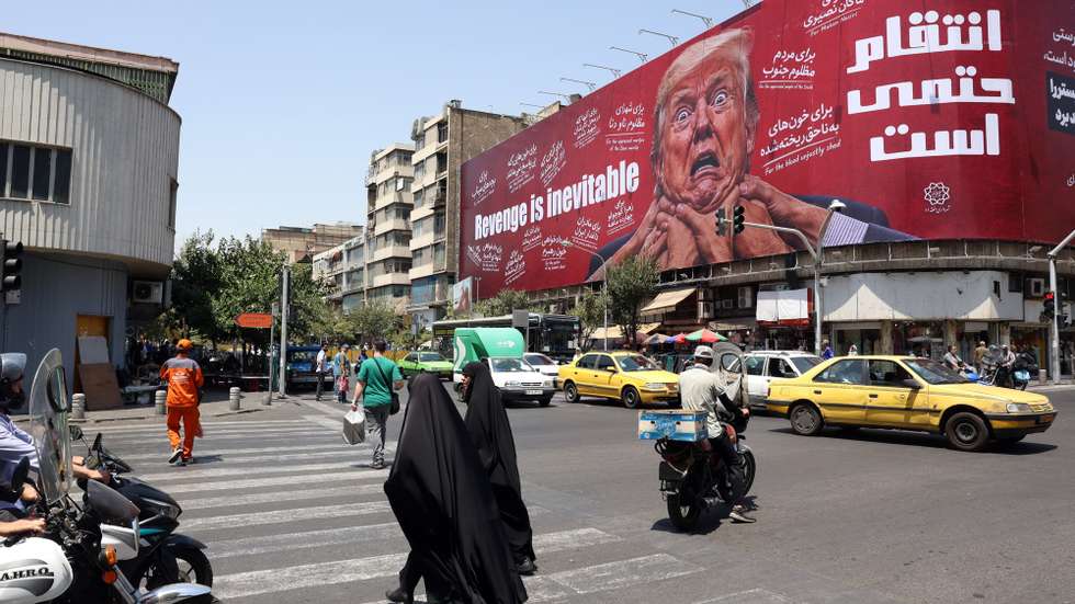 epa13135552 Women walk past an anti-US and Trump billboard in a street in Tehran, Iran, 27 July 2026. The US and Iran paused strikes and retaliatory attacks to pursue diplomatic efforts to end the conflict over the Strait of Hormuz.  EPA/ABEDIN TAHERKENAREH RESTRICTIONS: NO Access Israel Media/Persian Language TV Stations Outside Iran/Strictly No Access BBC Persian/VOA Persian/Manoto TV/Iran International TV. (As mandated by Iran's Directorate General for Foreign Media) --