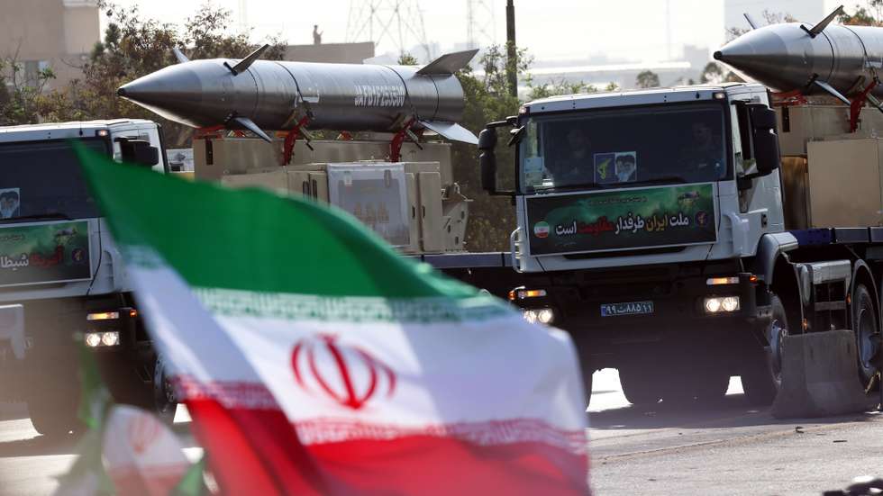 epa11616807 Trucks carry Iranian long-range missiles Fatah during the annual military parade marking the Iraqi invasion in 1980, which led to an eight-year-long war (1980-1988); in Tehran, Iran, 21 September 2024. According to IRNA newes agency, Iranian president Masoud Pezeshkian said 'our defense system power is on that level that no enemy even dares to think to attack against Iran, and we will continue to develop our defense system in any aspects.'  EPA/ABEDIN TAHERKENAREH