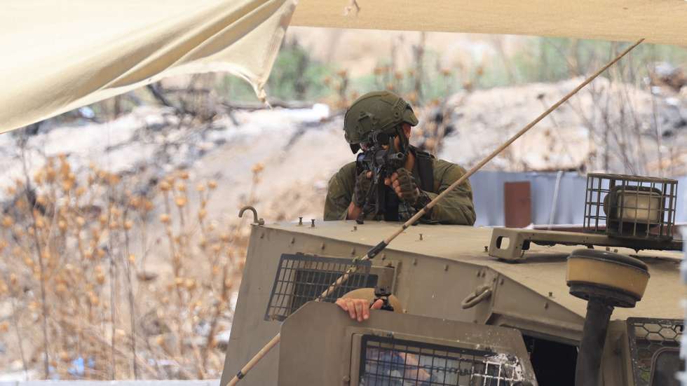 epa12255937 An Israeli soldier takes position during an army operation in the West Bank city of Nablus, 23 July 2025. According to the Palestinian Health Ministry, at least three Palestinians were wounded during the operation.  EPA/ALAA BADARNEH