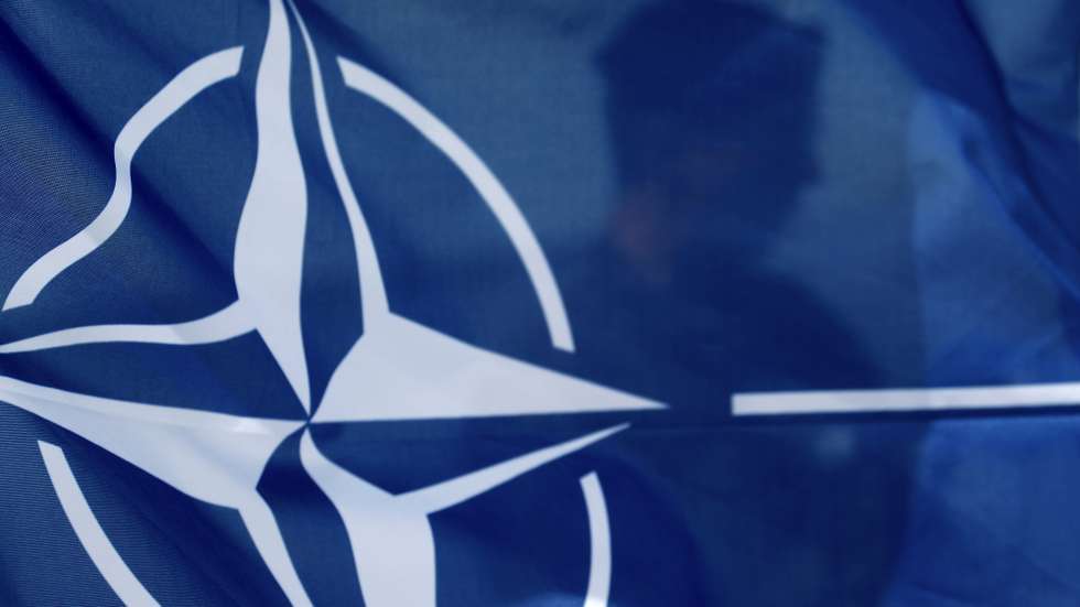 epa12141041 A NATO flag is seen during Media Day at the 'Latvian Shield 25' exercise at the Riga Hydroelectric Power Plant in Dole, Latvia, 28 May 2025. The exercise strengthens cooperation between Spanish and Latvian Air Force air defense units, enhancing the ability of Latvian and other NATO forces to jointly respond to air defense challenges.  EPA/TOMS KALNINS